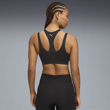 PUMA Bustier Sport bh 'Green Terrains' in Zwart
