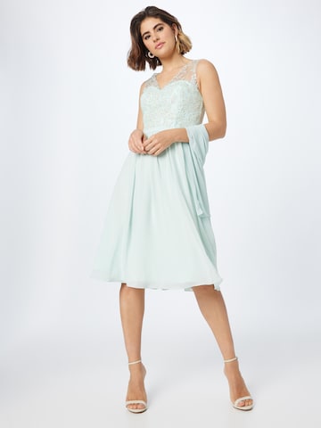 Rochie de cocktail de la mascara pe verde