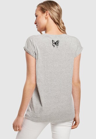 T-shirt 'Flowers Bloom' Merchcode en gris