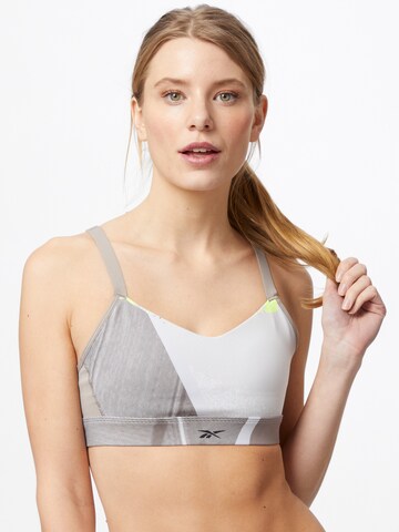 Reebok Bralette Sports Bra 'Lux Strappy Studio' in Yellow: front