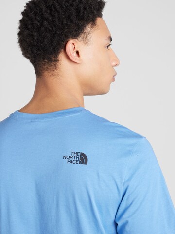 THE NORTH FACE T-shirt i blå