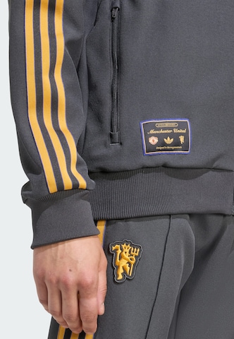 ADIDAS ORIGINALS Sweatjacke 'Manchester United Terrace Icons' in Schwarz