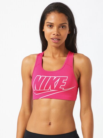 NIKE Bralette Sports bra 'Swoosh Futura' in Pink: front