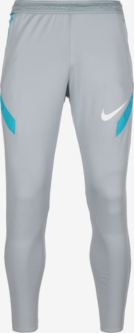 Coupe slim Pantalon de sport 'Strike' NIKE en gris : devant