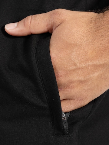 Loosefit Pantalon de sport ' Edin ' Smilodox en noir