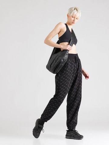 Effilé Pantalon 'PHOENIX FLEECE' Nike Sportswear en noir