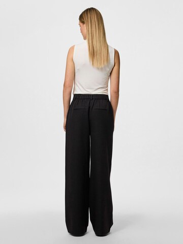 Wide leg Pantaloni 'Kamil' di PIECES in nero