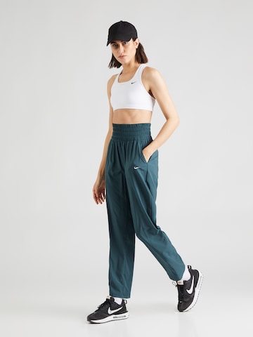 Regular Pantaloni sport 'One' de la NIKE pe albastru