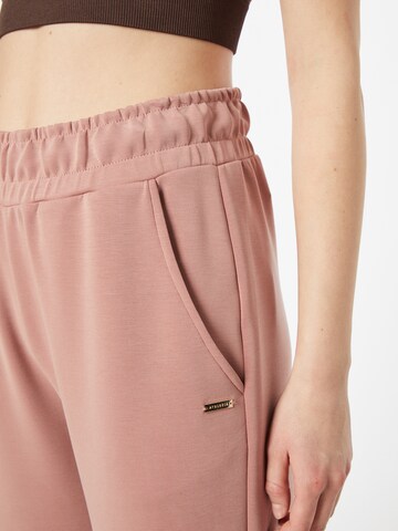 Effilé Pantalon de sport Athlecia en rose