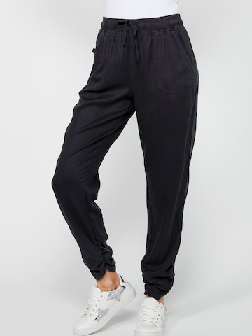 KOROSHI Loose fit Sports trousers in Black: front