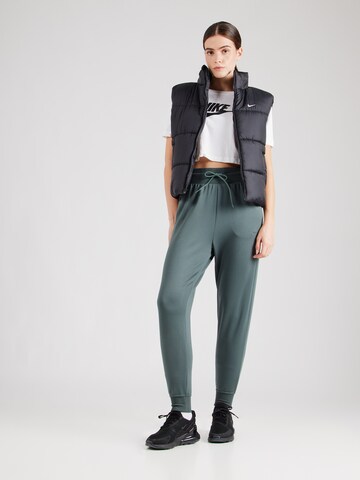 NIKE Tapered Sports trousers 'ONE' in Green