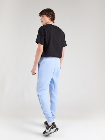 Tapered Pantaloni di Nike Sportswear in blu
