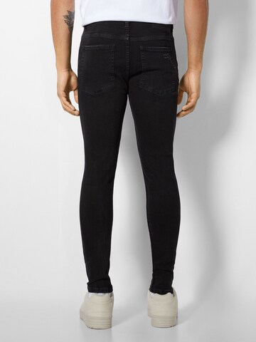 Skinny Jeans di Bershka in nero