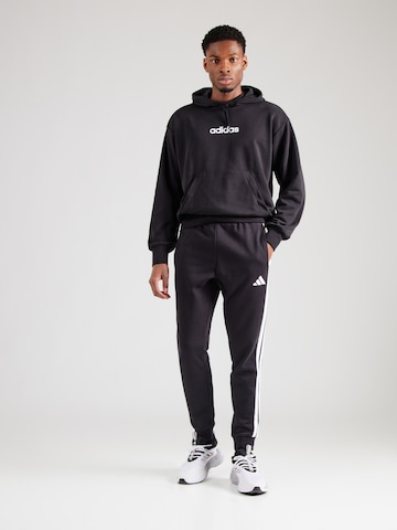 ADIDAS SPORTSWEAR Tapered Παντελόνι φόρμας σε μαύρο