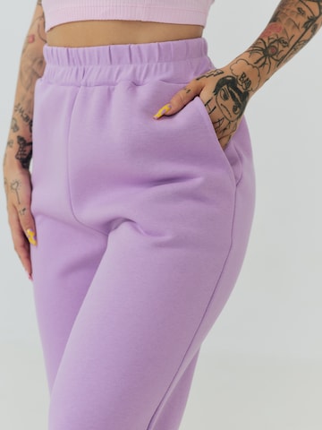 ABOUT YOU x Sharlota Tapered Pants 'Nala' in Purple