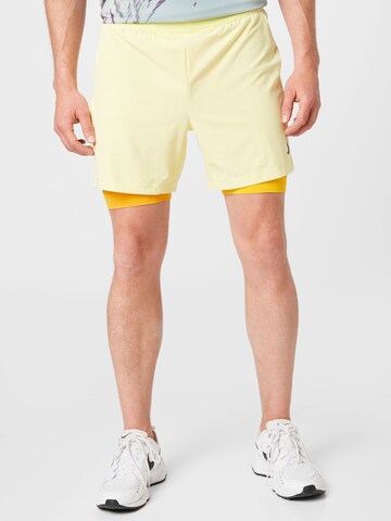 NIKE Regular Sports trousers in Yellow: front