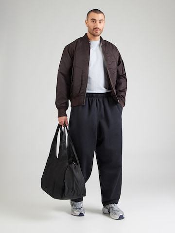 Nike Sportswear - Tapered Pantalón 'CLUB' en negro