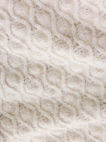 Next Neuletakki värissä beige