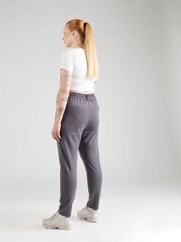 Tapered Pantaloni 'Goldtrash' di ONLY Carmakoma in grigio
