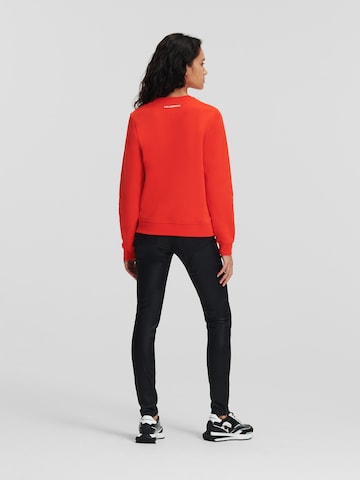Karl LagerfeldSweater majica 'Ikonik 2.0' - crvena boja