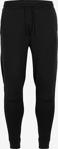 ICEBREAKER - Skinny Pantalón deportivo en negro: frente