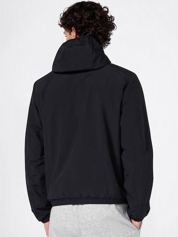 Champion Authentic Athletic Apparel Jacke in Schwarz