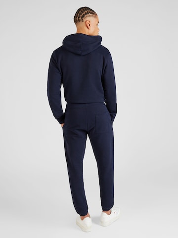 Tommy Jeans Tapered Broek in Blauw