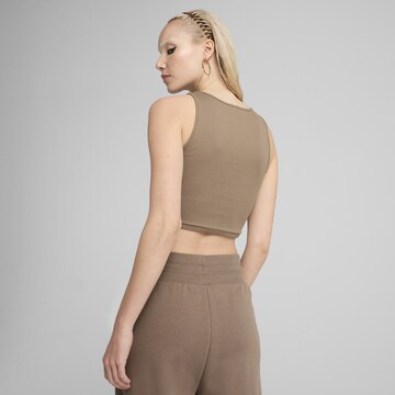 Haut de sport 'Wardrobe Ess' PUMA en marron