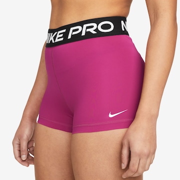 NIKE Skinny Workout Pants in Pink