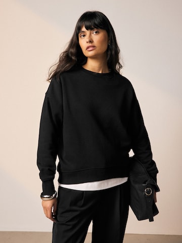 juoda Next Megztinis be užsegimo