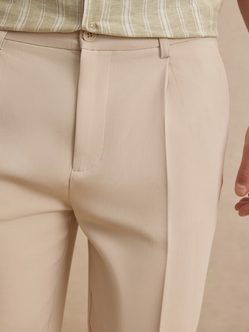 DAN FOX APPAREL Regular Pleat-Front Pants 'Toni' in Beige