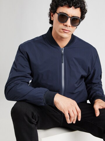 TOMMY HILFIGER Tussenjas in Blauw