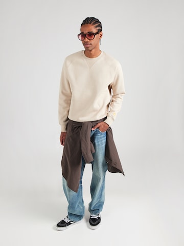 Carhartt WIP Majica 'Chase' | bež barva: sprednja stran