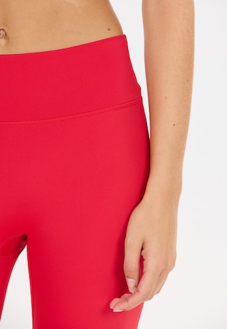 Athlecia Slim fit Sports trousers 'Blossom' in Red