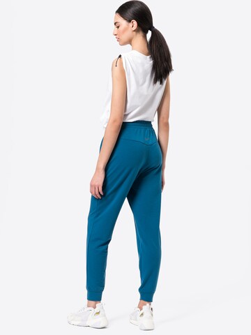 NIKE Tapered Workout Pants in Blue