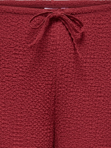 ONLY Carmakoma - Pierna ancha Pantalón 'CARERIKKA' en rojo