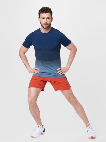 Regular Pantalon de sport 'SpeedPocket' UNDER ARMOUR en orange