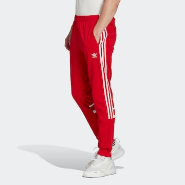 ADIDAS ORIGINALS Tapered Pants 'Adicolor Classics Cutline' in Red: front