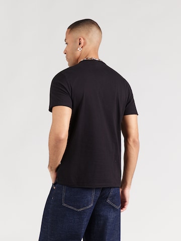 AMPLIFIED Paita 'NIRVANA - NEON FLOWERS' värissä musta