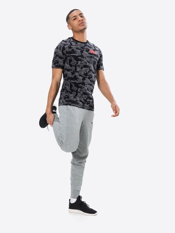 PUMATapered Sportske hlače - siva boja