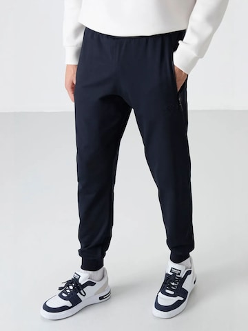 Pantaloni di Tommy Life in blu: frontale