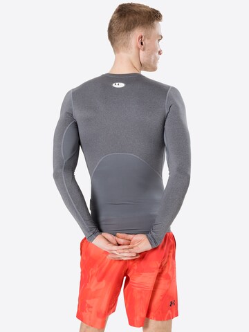 Maglia funzionale di UNDER ARMOUR in grigio