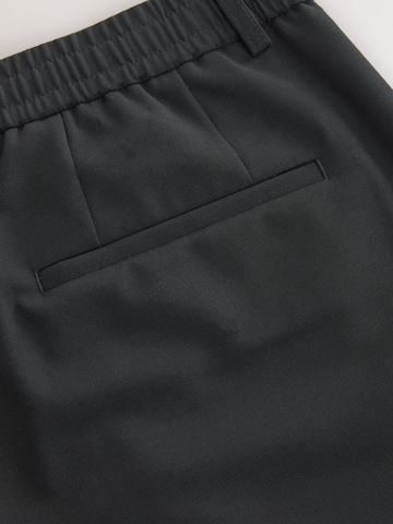 Next Slimfit Chino kalhoty 'Smart Motionflex' – černá