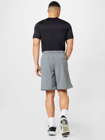 NIKE Regularen Športne hlače | siva barva