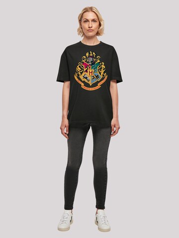 F4NT4STIC Shirt 'Harry Potter Hogwarts Crest Gold' in Zwart