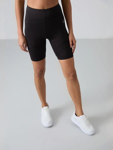 Effilé Leggings 'Gamaschen' Tommy Life en noir