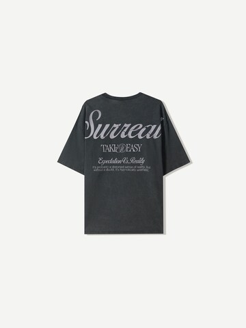 T-Shirt 'SURREAL' Bershka en noir