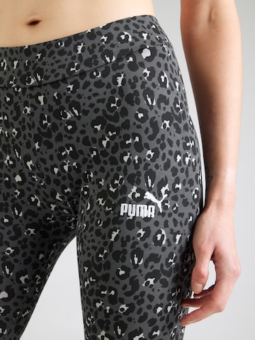 PUMA Skinny Urheiluhousut 'Essentials' värissä musta