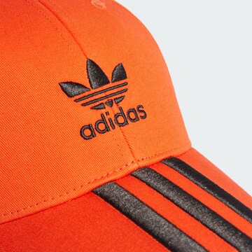 ADIDAS ORIGINALS Cap in Orange