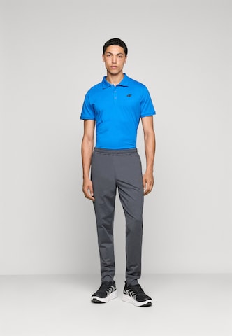 Tapered Pantaloni sportivi di 4F in grigio